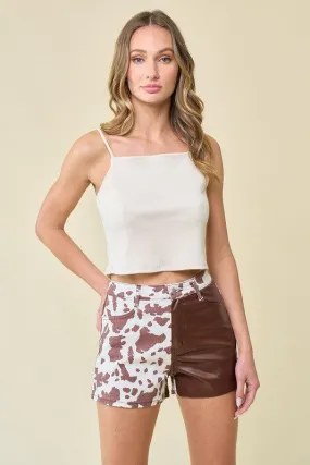 SANDY TWO TONE COW PRINT SHORTS WITH PU CONTRAST